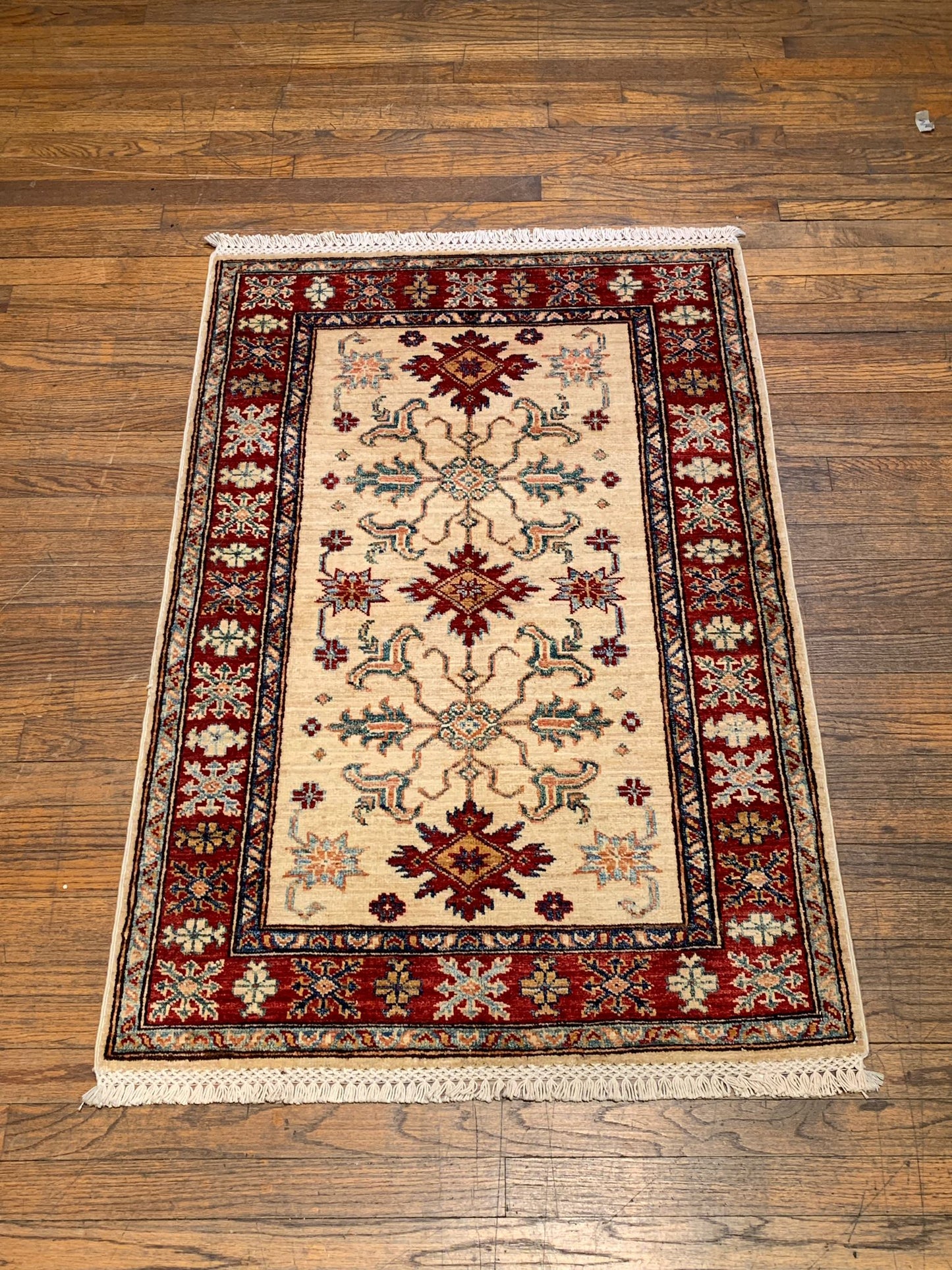 Hand-Knotted Vegetable Dye Kazak Rug from Pakistan, size 2' 9" x 4"