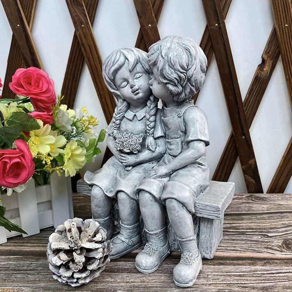 Boy Kissing Girl Statue Sitting on Bench Figurine